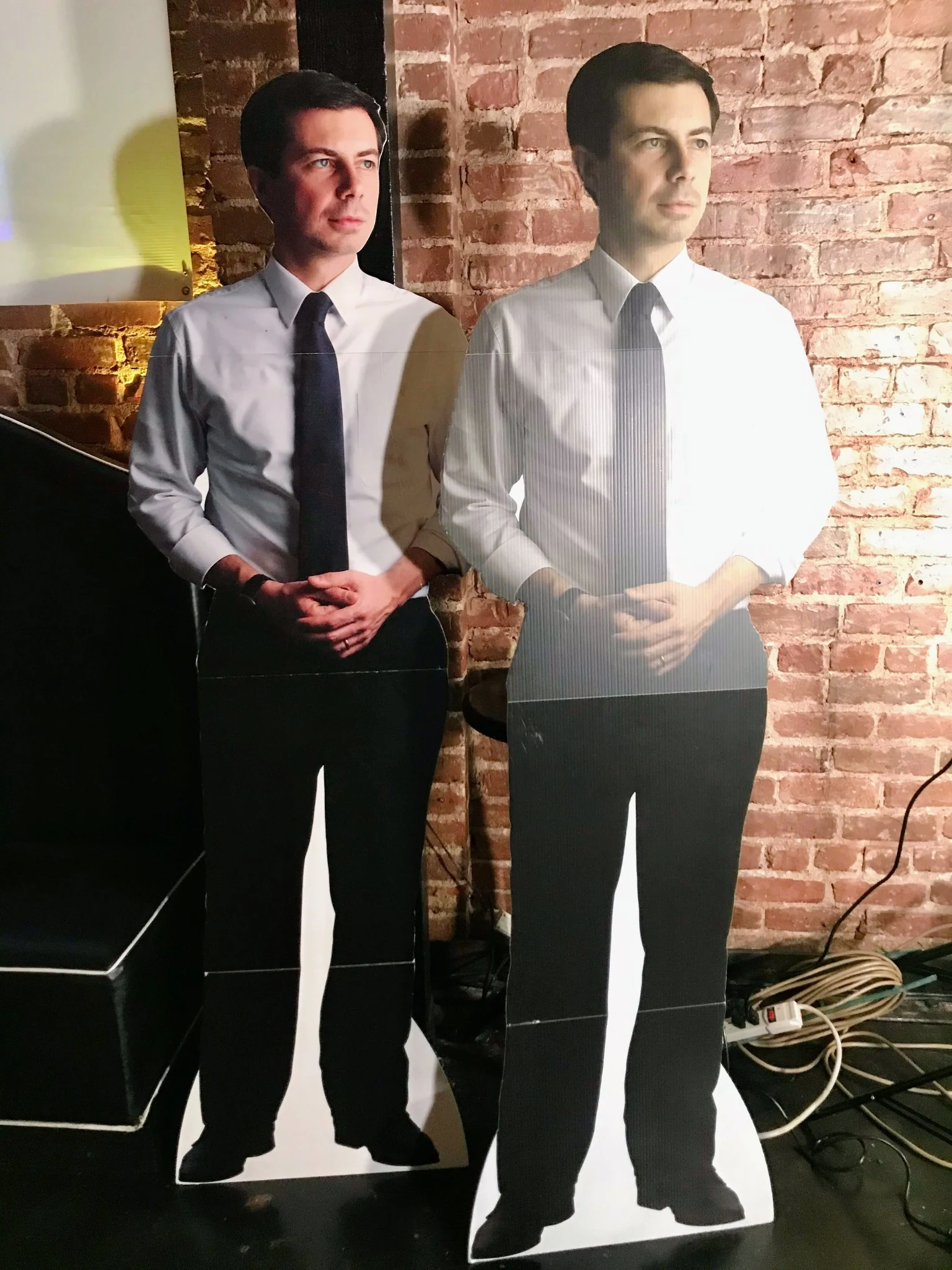 Cardboard Pete Buttigieg cutouts at the final gathering