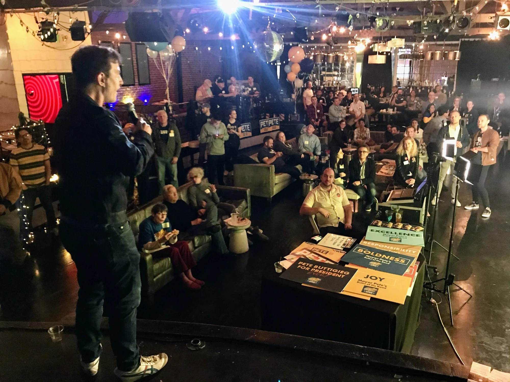 At the final Super Tuesday watch party, an organizer addresses the room